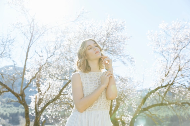 Free Photo young woman posing under sunlight