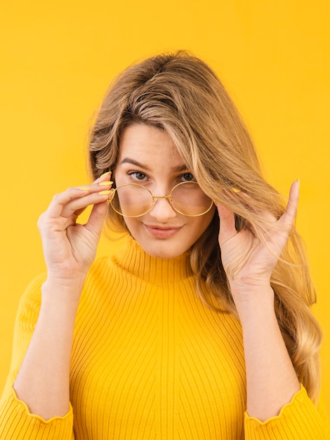 Young woman posing with glasses