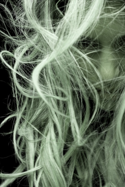 Young woman posing with hair over face