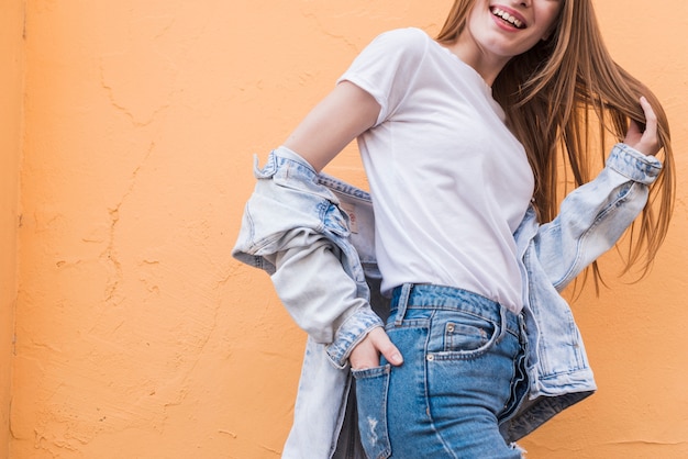 Young woman posing with hand's in pocket