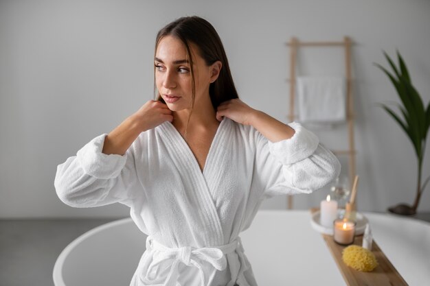 Young woman preparing for her bath time