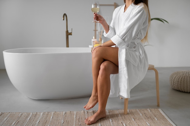 Free photo young woman preparing for her bath time