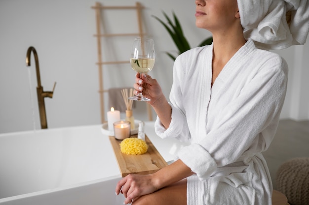 Free photo young woman preparing for her bath time