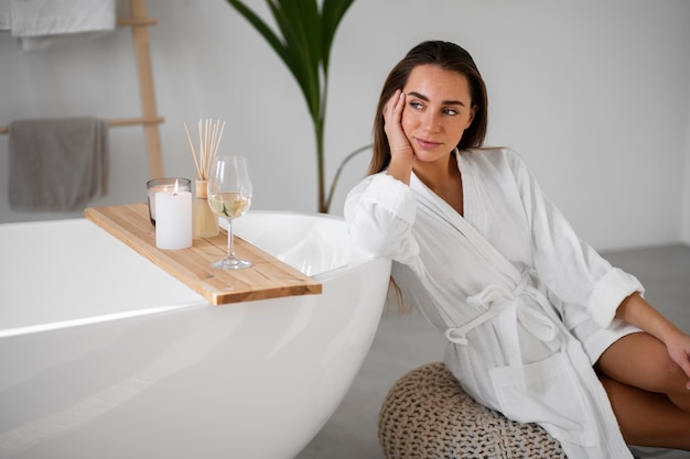 Young woman preparing for her bath time