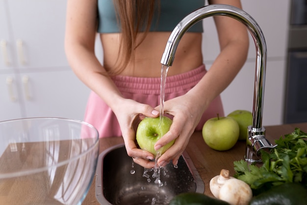 Free photo young woman preparing her nutrition diet