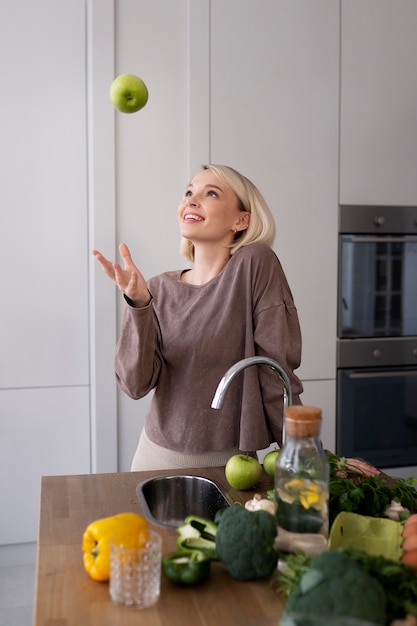 Free photo young woman preparing her nutrition diet