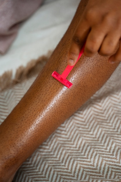 Free Photo young woman preparing for shaving her body