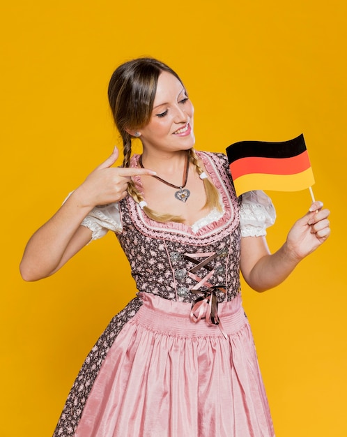 Free photo young woman proud of german flag