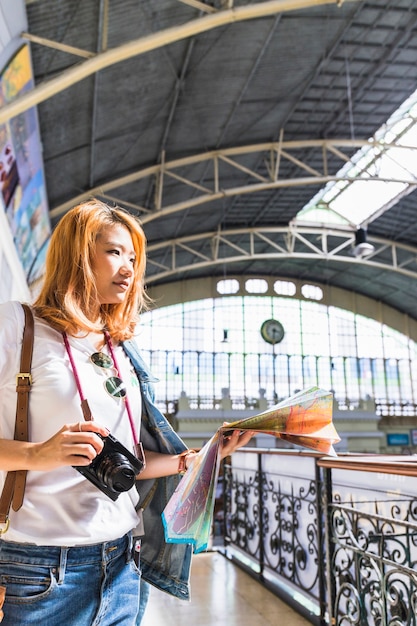 Free photo young woman on railway station