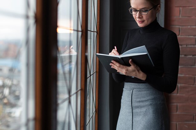 Young woman reading magazine