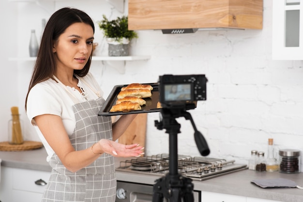 Young woman recording for a cooking show