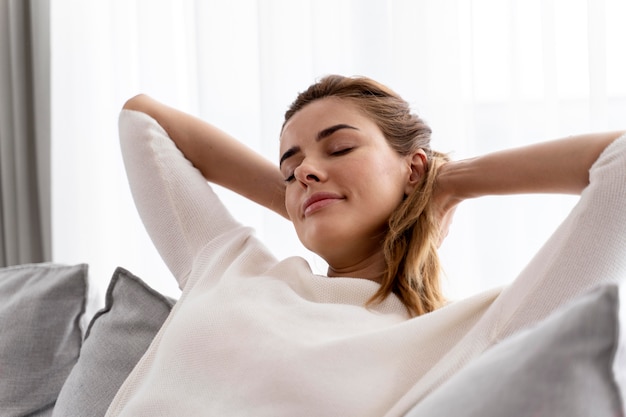 Free photo young woman relaxing alone at home