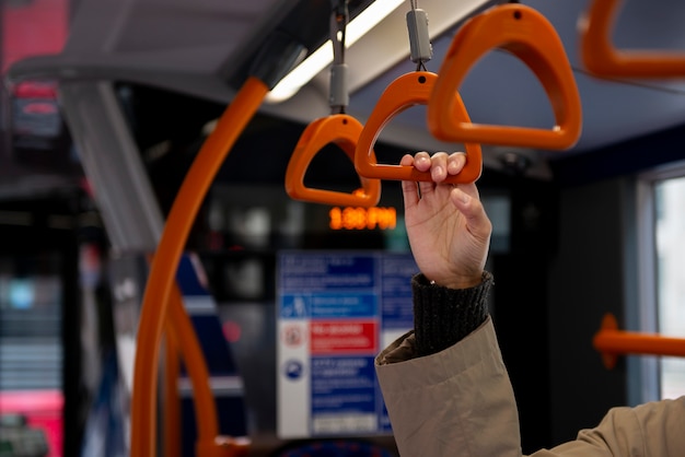 Free photo young woman riding the bus in the city