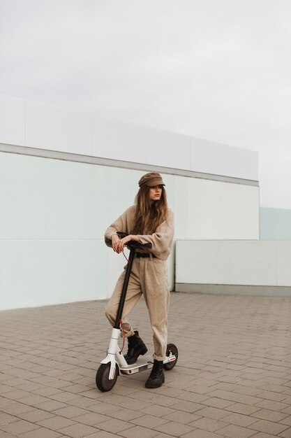 Young woman riding an electric scooter