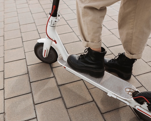 Young woman riding an electric scooter