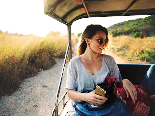 Young woman on the road trip to the nature