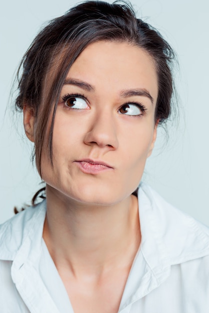 Free Photo the young woman's portrait with thoughtful emotions