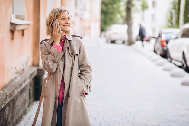 Free photo young woman shopping online on phone