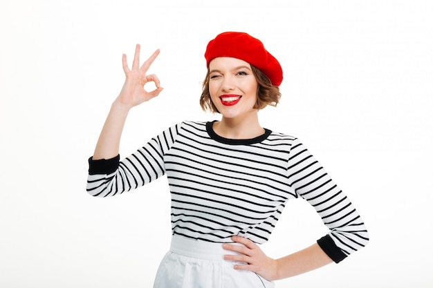 Young woman showing okay gesture.