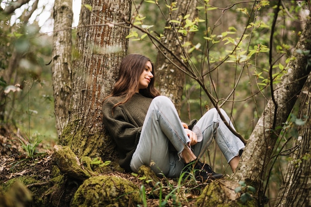 Young woman sitting in nature