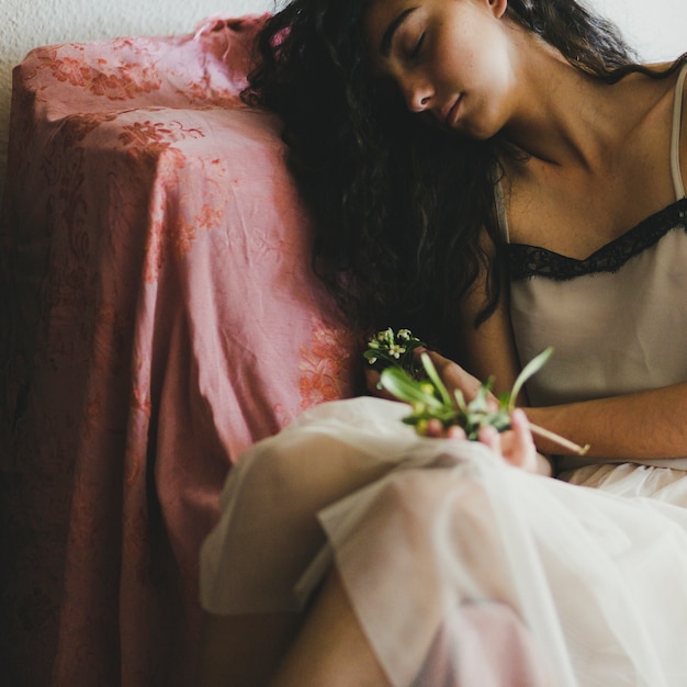 Free Photo young woman sleeping with flowers