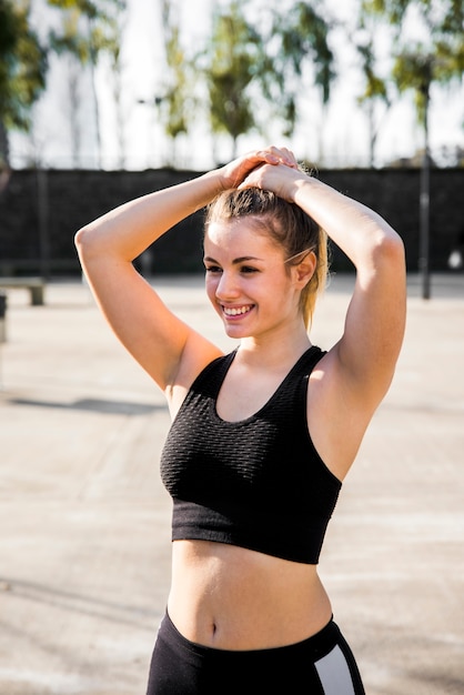 Free Photo young woman smiling while resting