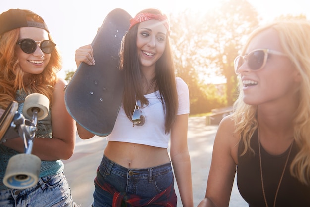 Young woman spending time together in skatepark