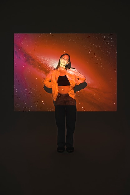 Free Photo young woman standing in universe texture projection