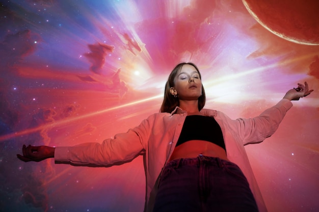 Free Photo young woman standing in universe texture projection