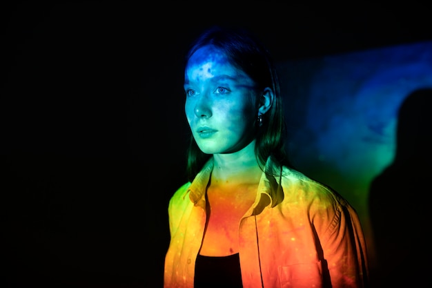 Young woman standing in universe texture projection