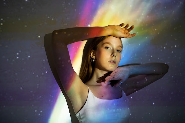 Young woman standing in universe texture projection