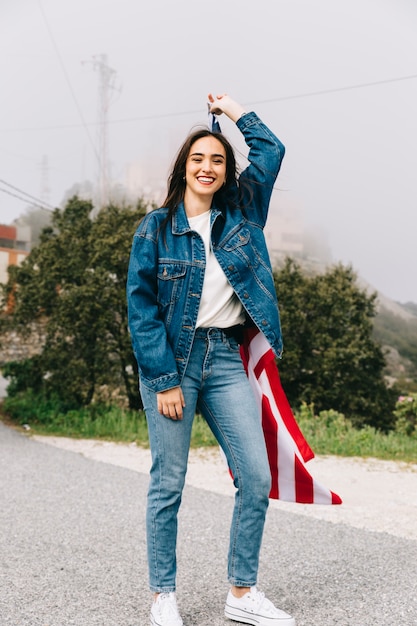 Free photo young woman staying in industrial zone