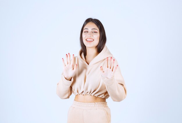 Young woman stopping and isolating herself from something