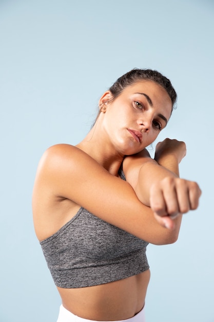 Young woman stretching before workout