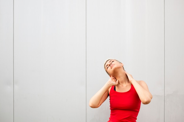 Young woman stretching outside