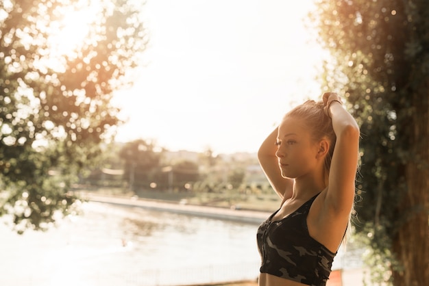 Young woman stretching in the park