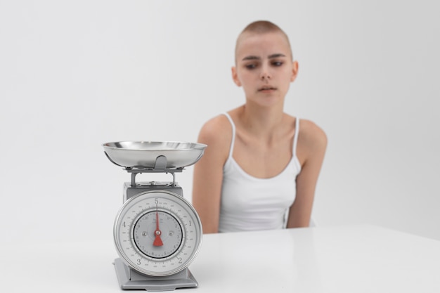 Free photo young woman struggling with an eating disorder