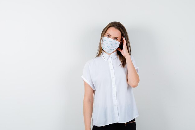 Young woman suffering from headache