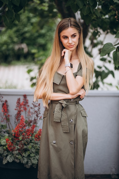 Young woman in summer outfit outside cafe