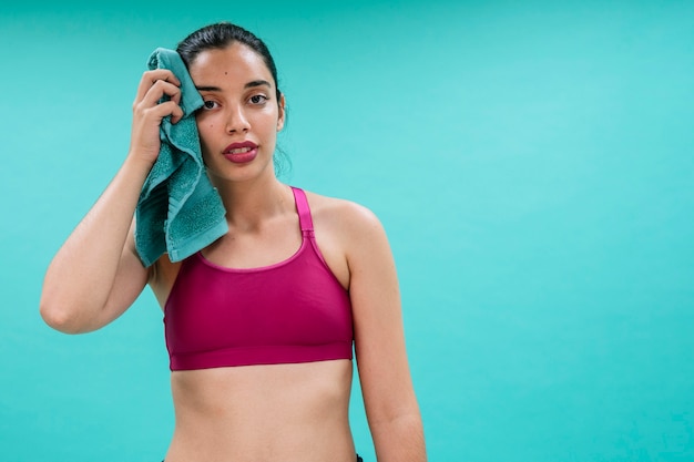 Young woman sweating after training