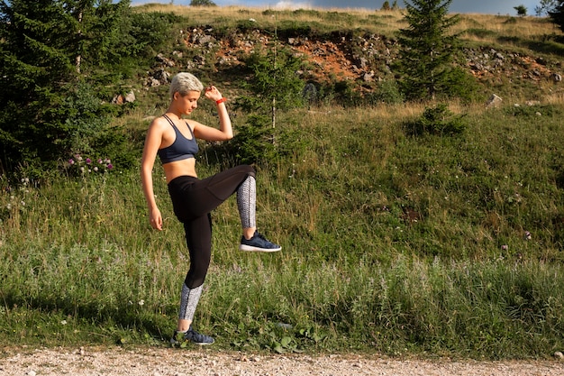 Young woman taking a break from running