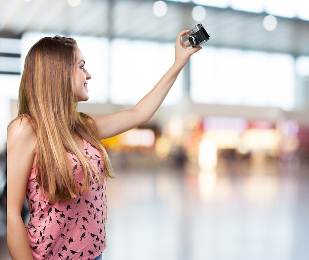 young woman taking a selfie on white background