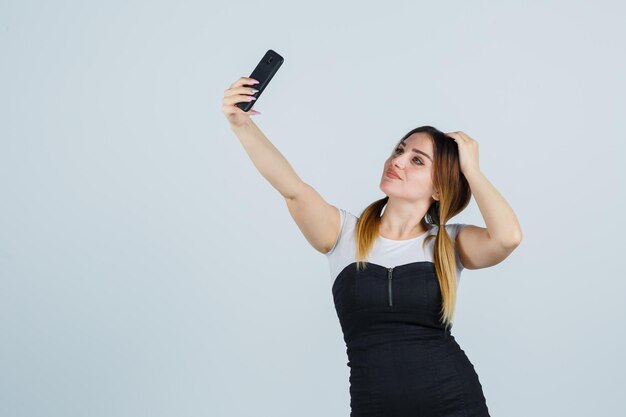 Young woman taking selfie