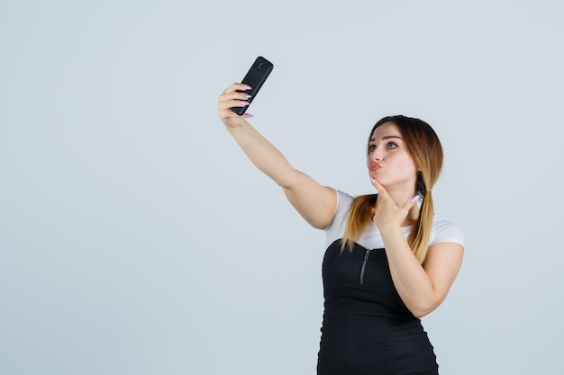 Young woman taking selfie