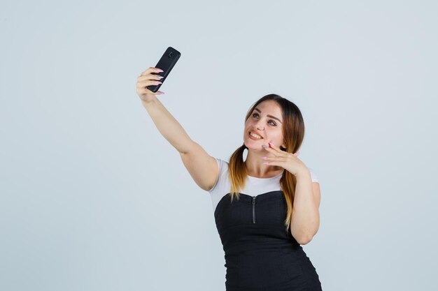 Young woman taking selfie