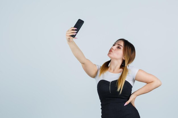 Young woman taking selfie