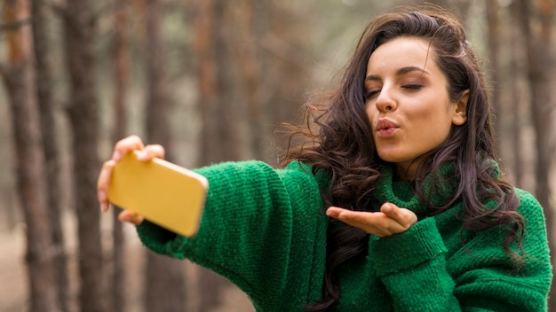 Young woman taking selfie