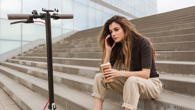 Free photo young woman talking on the phone