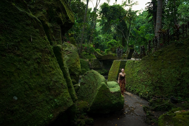 Young woman among temple ruins