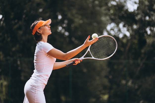 Young woman tennis player at the court